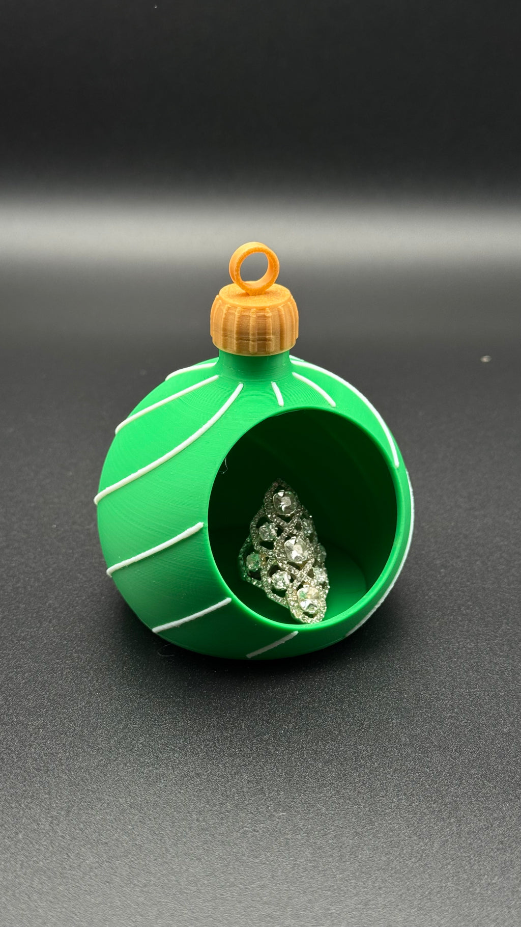 Green spherical ornament gift box with gold top